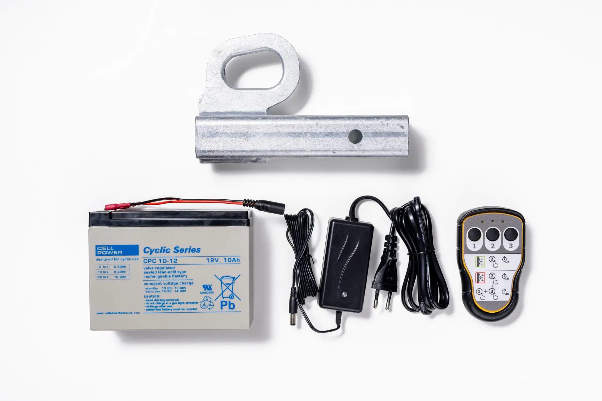 Accessoires pour Hoeflon C600 : batterie, câbles, chargeur et télécommande.