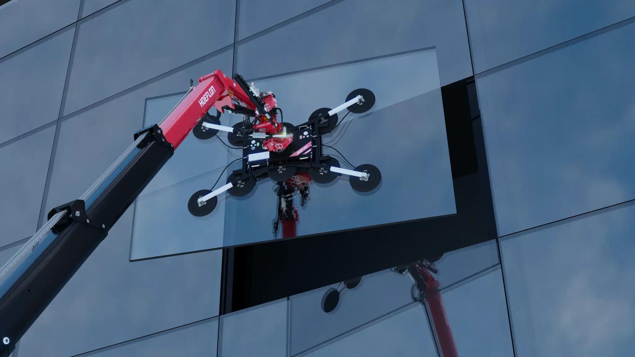 Grue Hoeflon avec ventouse à verre plaçant du verre sur un bâtiment.