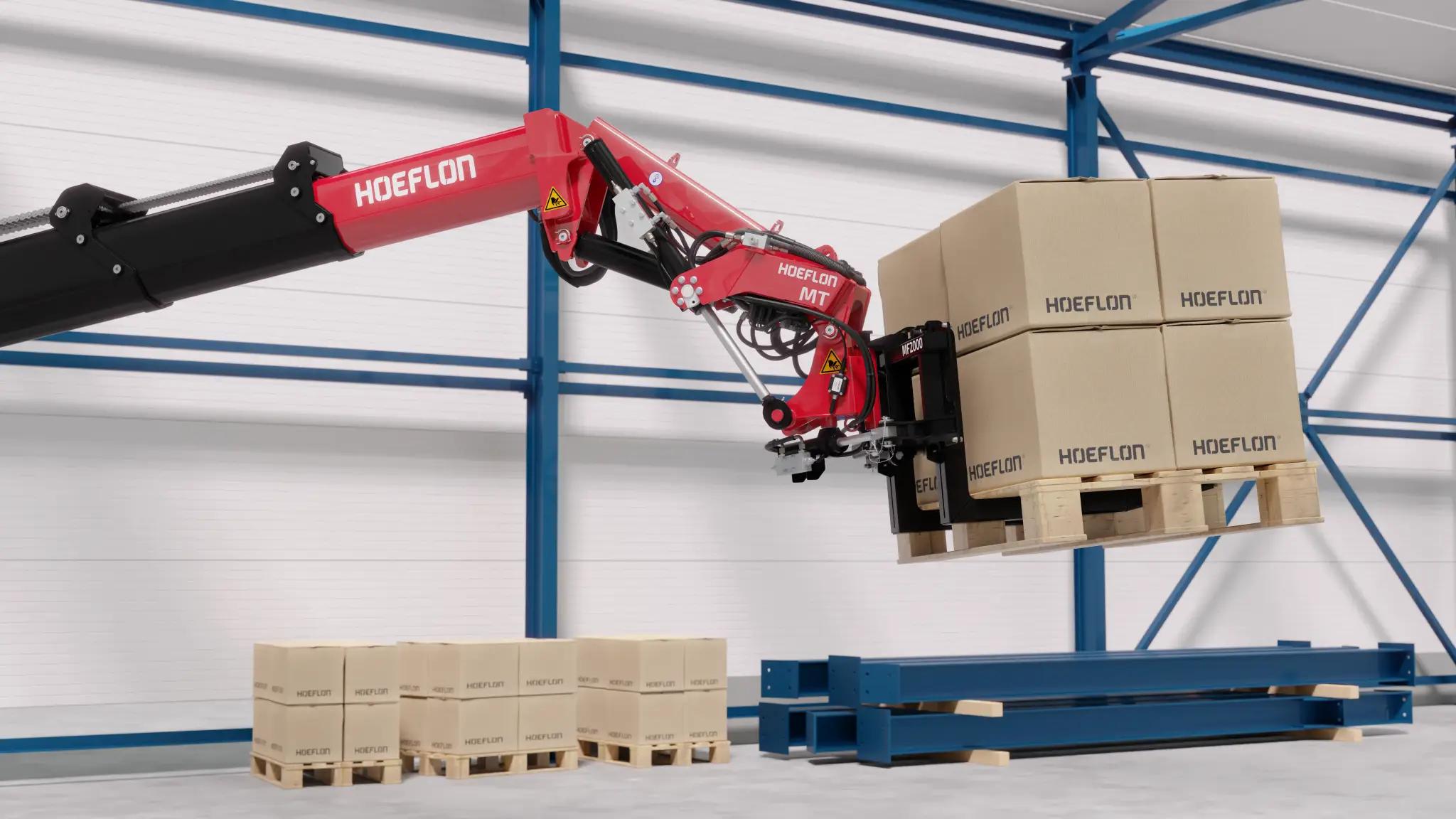 Hoeflon Multitool soulevant une palette de cartons dans un entrepôt.